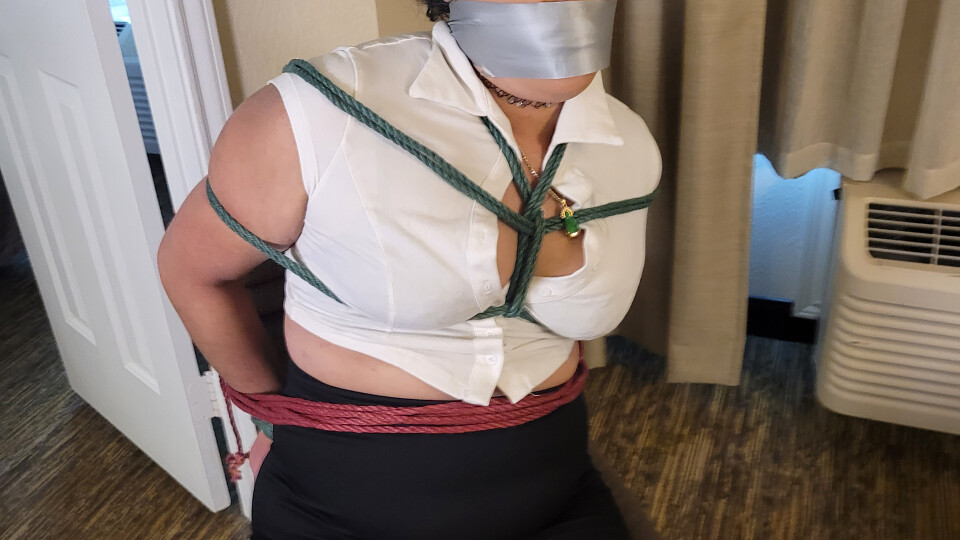 Secretary Kim Chi tied to a chair and tape gagged